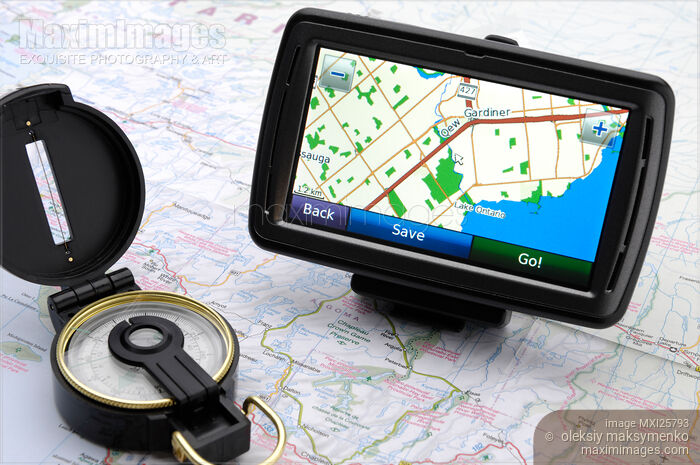 Stock photo of Automotive GPS on map with compass Buy commercial use license at MaximImages