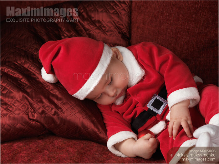 Baby Boy in Santas Costume Sleeping on a Sofa Stock photo of Baby Boy in Santas Costume Sleeping on a Sofa Buy commercial use license at MaximImages