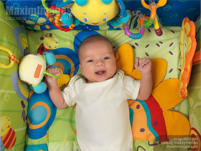 Photo of Baby Boy Lying on a Play Mat Stock Image MXI22286
