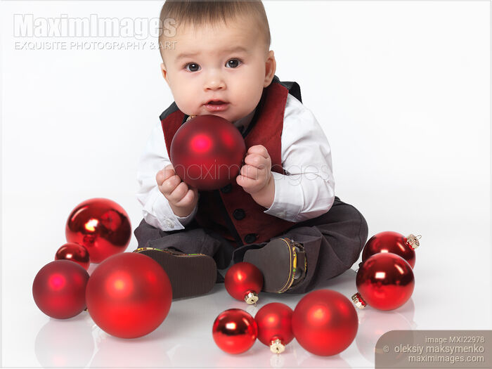 Baby Boy Playing with Christmas Baubles Stock photo of Baby Boy Playing with Christmas Baubles Buy commercial use license at MaximImages