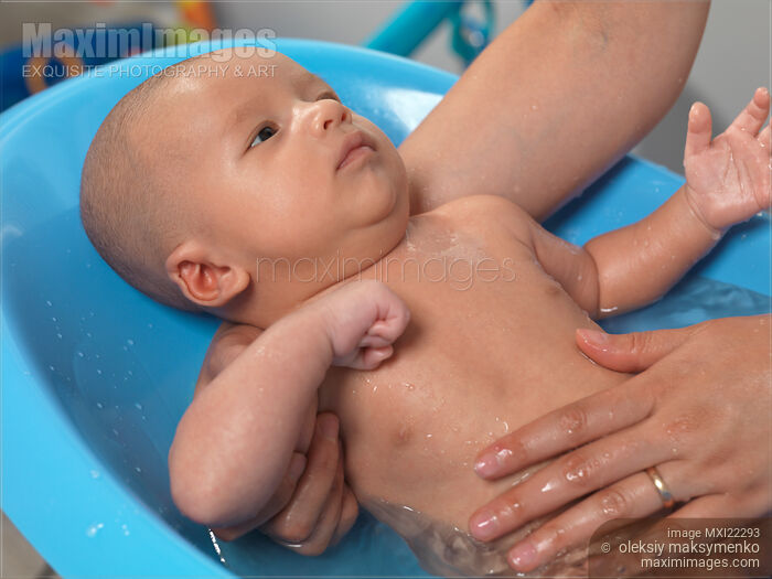 Stock photo of Baby Boy Taking a Bath Buy commercial use license at MaximImages