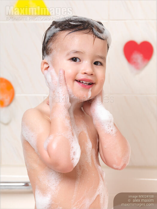Stock photo of Baby boy taking a bubble bath Buy commercial use license at MaximImages