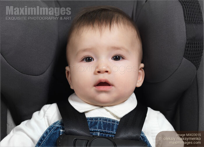 Photo of Baby in a Booster Seat Stock Image MXI23015