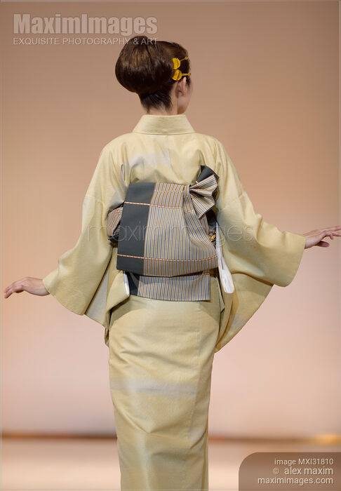 Back of a Japanese woman showing an obi belt of an elegant light green kimono Stock photo of Back of a Japanese woman showing an obi belt of an elegant light green kimono Buy commercial use license at MaximImages