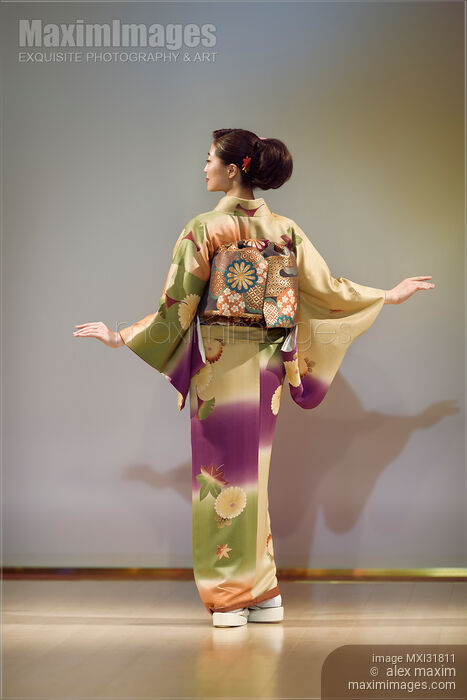 Back of a woman in beautiful kimono at a fashion show in Japan Stock photo of Back of a woman in beautiful kimono at a fashion show in Japan Buy commercial use license at MaximImages