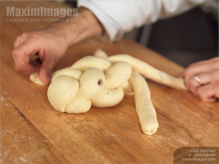 Stock photo of Baker Making Braided Bread Buy commercial use license at MaximImages