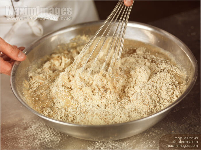 Stock photo of Baker Whisking Batter Buy commercial use license at MaximImages