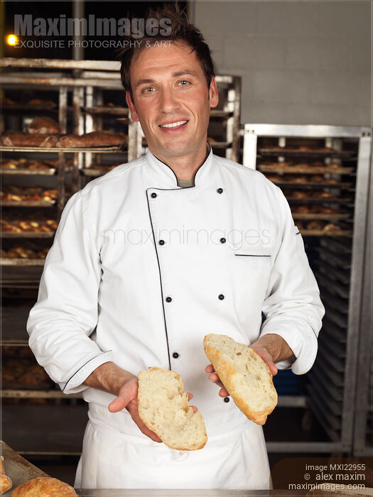 Baker with a Freshly Baked Bread in His Hands Stock photo of Baker with a Freshly Baked Bread in His Hands Buy commercial use license at MaximImages