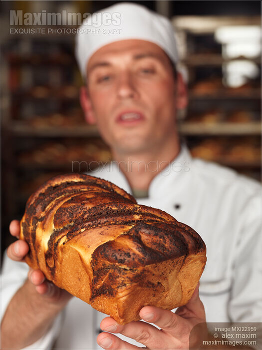 Baker with a Freshly Baked Bread in His Hands Stock photo of Baker with a Freshly Baked Bread in His Hands Buy commercial use license at MaximImages