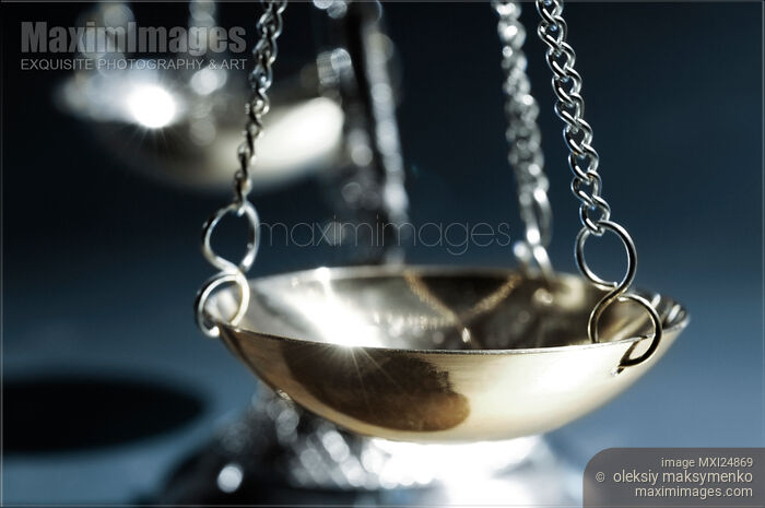 Balanced Justice Scales Closeup Stock photo of Balanced Justice Scales Closeup Buy commercial use license at MaximImages