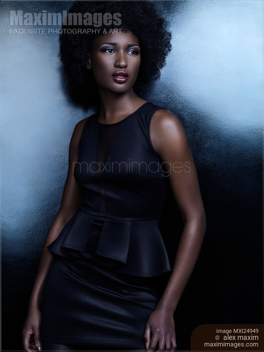 Beautiful african american woman in shiny black dress Stock photo of Beautiful african american woman in shiny black dress Buy commercial use license at MaximImages