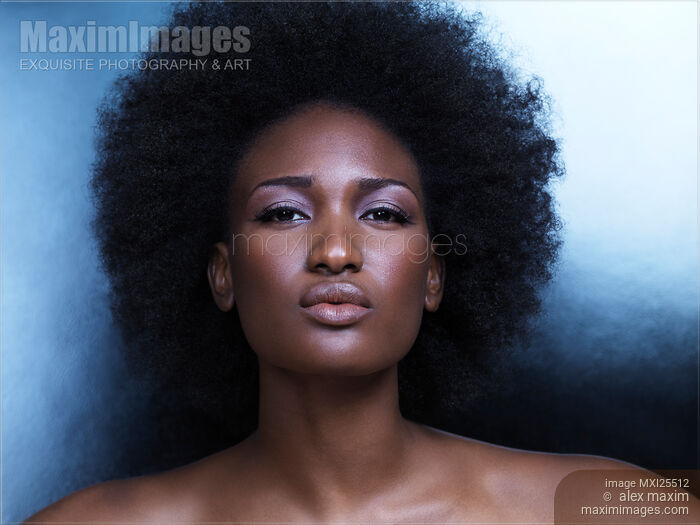 Beautiful african american woman pouting her lips Stock photo of Beautiful african american woman pouting her lips Buy commercial use license at MaximImages