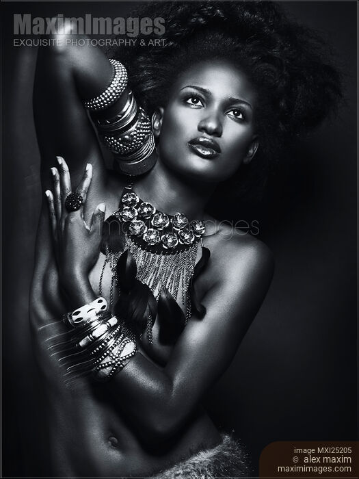 Stock photo of Beautiful African American Woman Wearing Jewelry Buy commercial use license at MaximImages