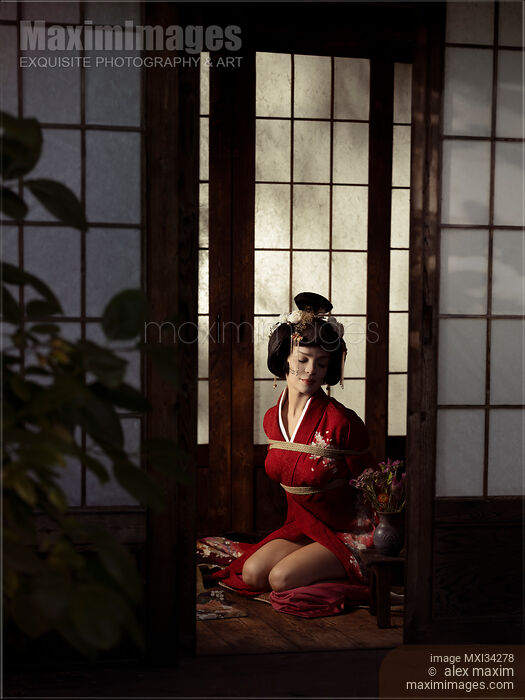Beautiful caucasian lady, Japanese geisha in red kimono sitting tied up with Shibari bondage ropes Stock photo of Beautiful caucasian lady, Japanese geisha in red kimono sitting tied up with Shibari bondage ropes Buy commercial use license at MaximImages