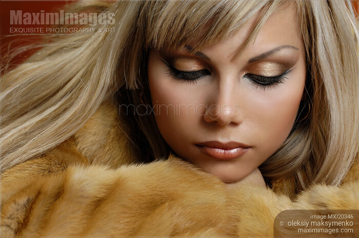 Beautiful Expressive Woman with Golden Hair Stock photo of Beautiful Expressive Woman with Golden Hair Buy commercial use license at MaximImages