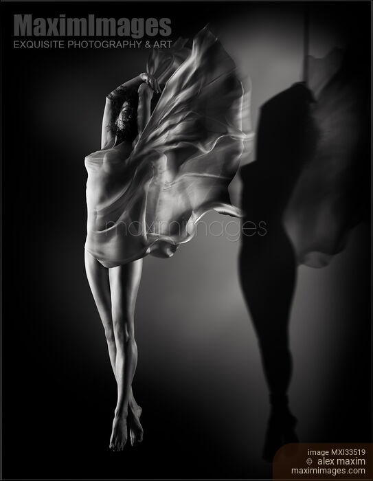 Beautiful half-naked woman with wing-like cloth wrapped around her nude body and her shadow suspended with bondage ropes Stock photo of Beautiful half-naked woman with wing-like cloth wrapped around her nude body and her shadow suspended with bondage ropes Buy commercial use license at MaximImages