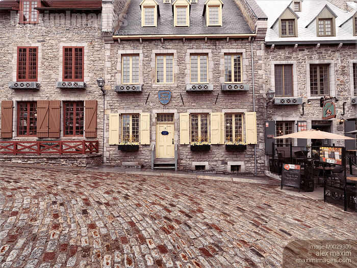 Stock photo of Beautiful historic French architecture houses in Royal Square Place Royale in Old Quebec City Buy commercial use license at MaximImages
