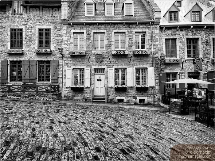 Stock photo of Beautiful historic French architecture houses in Royal Square Place Royale in Old Quebec City Black and white Buy commercial use license at MaximImages