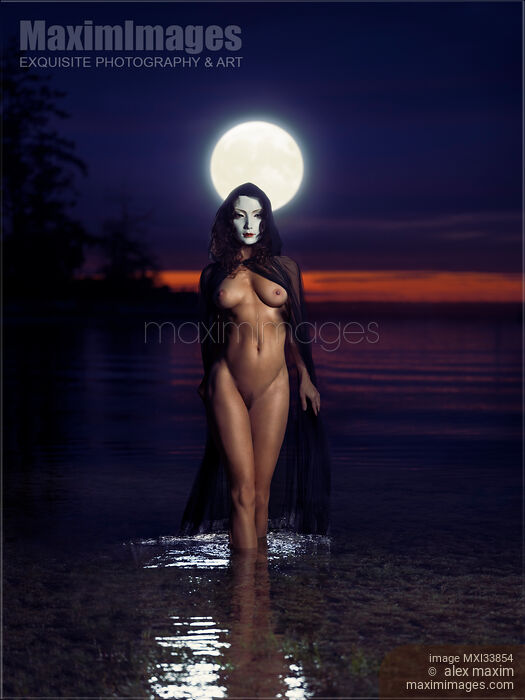 Beautiful mysterious woman in white face mask with sensual nude body walking out of the water like a goddess in full moon. Moon Goddess. Stock photo of Beautiful mysterious woman in white face mask with sensual nude body walking out of the water like a goddess in full moon. Moon Goddess. Buy commercial use license at MaximImages