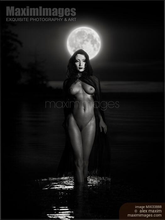 Beautiful mysterious woman in white face mask with sensual nude body walking out of the water like a goddess in full moon. Black and white Stock photo of Beautiful mysterious woman in white face mask with sensual nude body walking out of the water like a goddess in full moon. Black and white Buy commercial use license at MaximImages