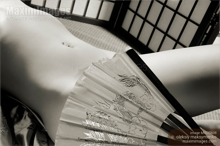 Beautiful Naked Asian Woman Body with a Hand Fan Stock photo of Beautiful Naked Asian Woman Body with a Hand Fan Buy commercial use license at MaximImages