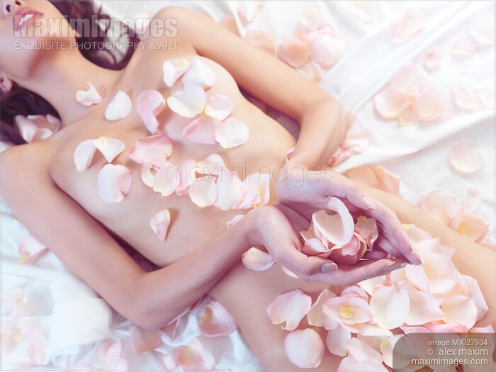 Stock photo of Beautiful nude asian woman with rose petals on her body Buy commercial use license at MaximImages