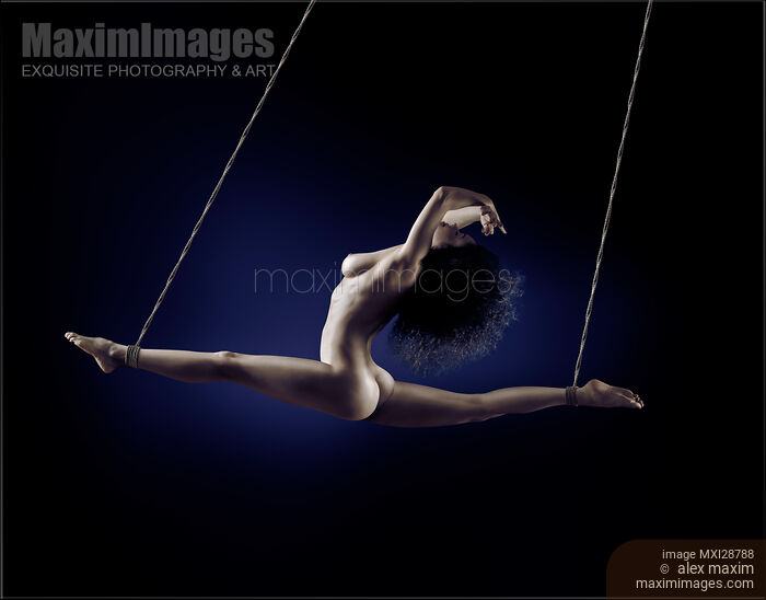 Beautiful nude woman flying suspended in splits by her ankles with bondage ropes Stock photo of Beautiful nude woman flying suspended in splits by her ankles with bondage ropes Buy commercial use license at MaximImages