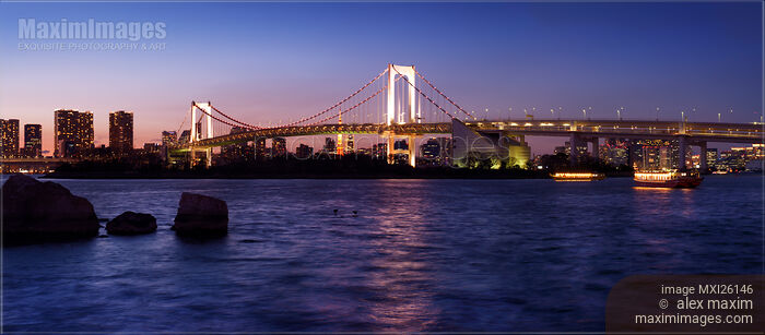 Stock photo of Beautiful panoramic scenery of the Rainbow bridge in Tokyo at night Buy commercial use license at MaximImages