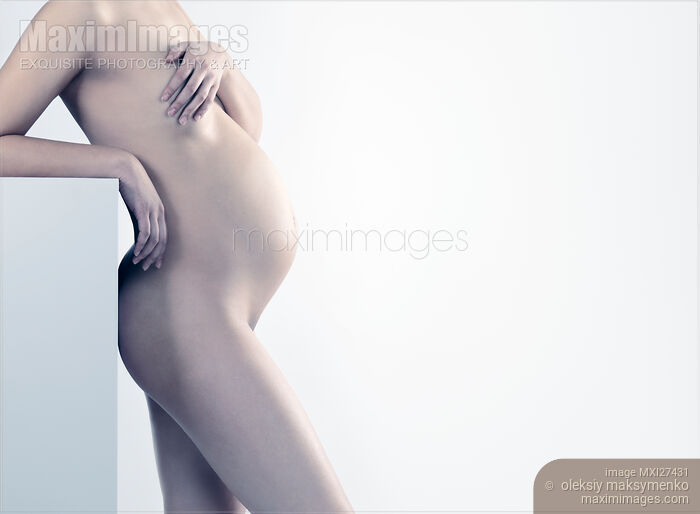 Stock photo of Beautiful pregnant woman body artistic photo Buy commercial use license at MaximImages