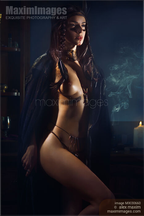 Beautiful sexy half nude Native American woman tribal shaman in black cloak Stock photo of Beautiful sexy half nude Native American woman tribal shaman in black cloak Buy commercial use license at MaximImages