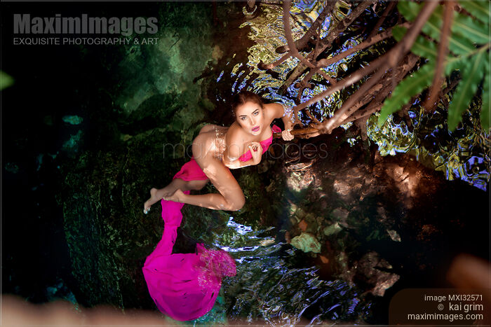 Beautiful sexy nude woman in turquoise water covering her naked body with pink cloth Stock photo of Beautiful sexy nude woman in turquoise water covering her naked body with pink cloth Buy commercial use license at MaximImages