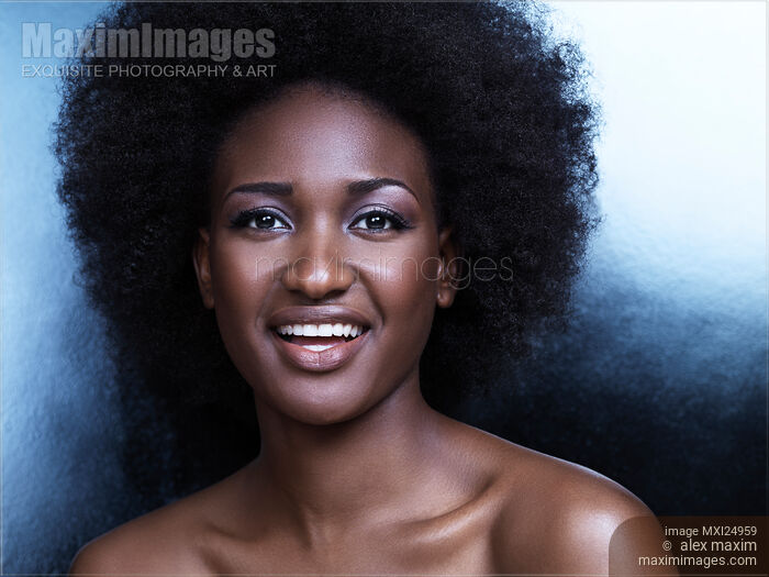 Stock photo of Beautiful smiling black african american woman face portrait Buy commercial use license at MaximImages