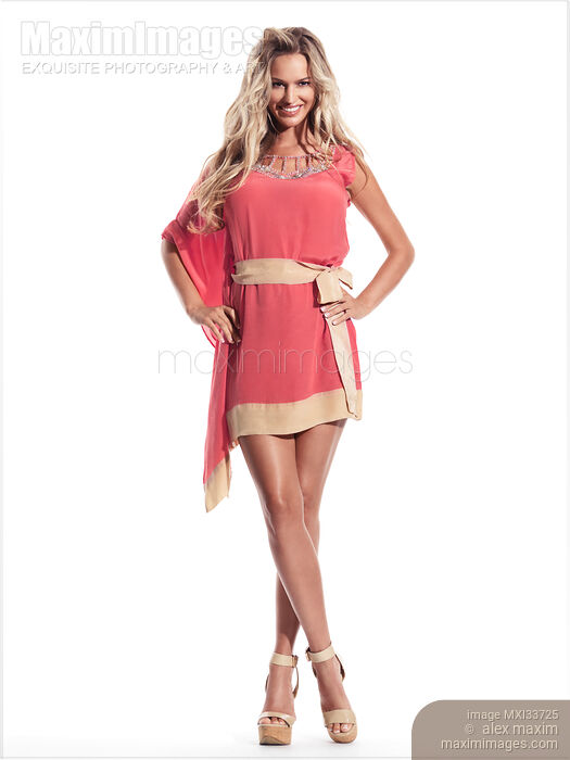 Beautiful smiling blond woman wearing sheer coral red beachwear dress cover Stock photo of Beautiful smiling blond woman wearing sheer coral red beachwear dress cover Buy commercial use license at MaximImages