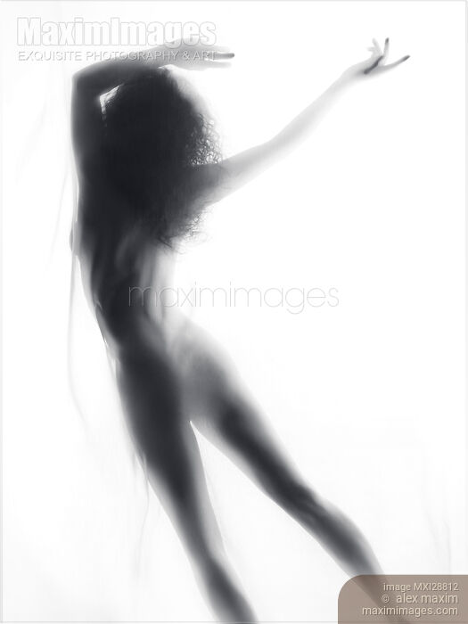 Beautiful surreal silhouette of a nude woman figure in glowing foggy light Stock photo of Beautiful surreal silhouette of a nude woman figure in glowing foggy light Buy commercial use license at MaximImages