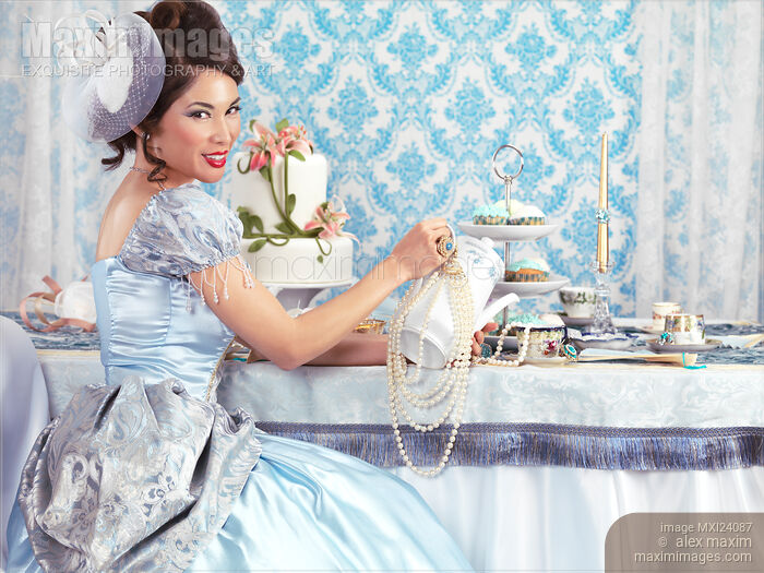 Stock photo of Beautiful tea party hostess Buy commercial use license at MaximImages