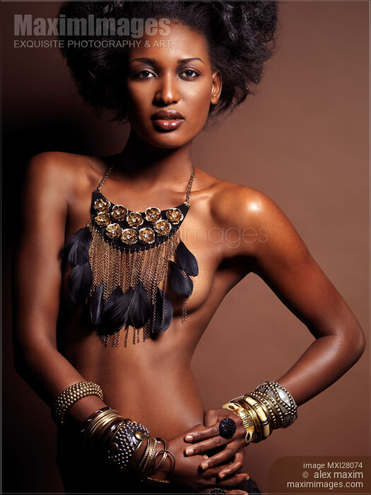 Stock photo of Beautiful topless african american woman wearing jewelry Buy commercial use license at MaximImages