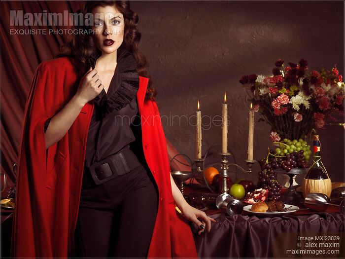 Beautiful Woman at a Festive Table Stock photo of Beautiful Woman at a Festive Table Buy commercial use license at MaximImages