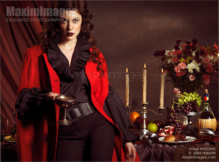 Beautiful Woman at a Festive Table Stock photo of Beautiful Woman at a Festive Table Buy commercial use license at MaximImages
