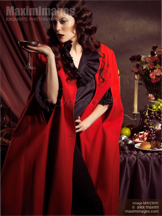 Beautiful Woman at a Festive Table Stock photo of Beautiful Woman at a Festive Table Buy commercial use license at MaximImages