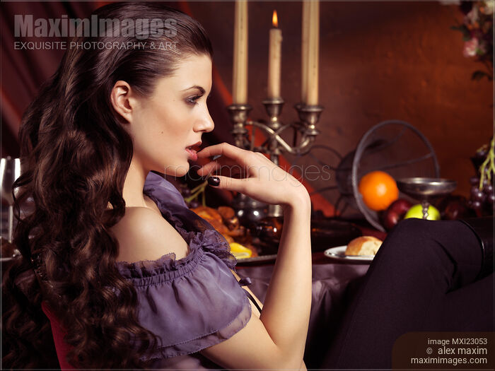 Beautiful Woman at a Festive Table Stock photo of Beautiful Woman at a Festive Table Buy commercial use license at MaximImages