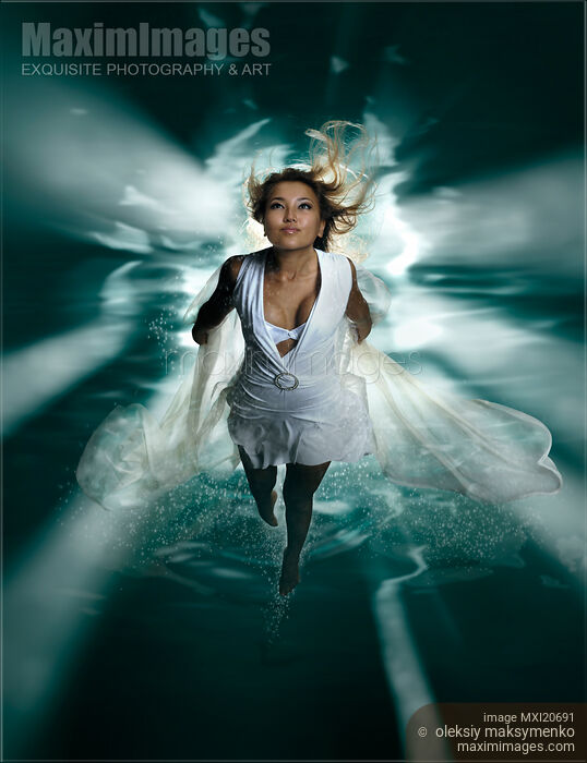 Stock photo of Beautiful Woman Diving in the Water Buy commercial use license at MaximImages