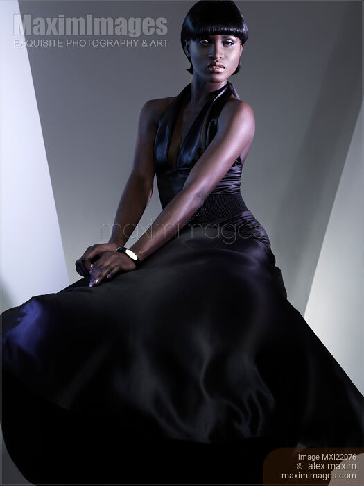 Stock photo of Beautiful Woman in Black Dress Buy commercial use license at MaximImages
