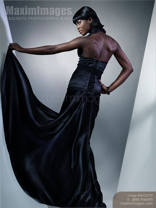 Stock photo of Beautiful Woman in Black Dress Buy commercial use license at MaximImages