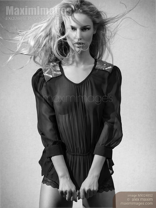 Beautiful woman in black see-through top Black and white Stock photo of Beautiful woman in black see-through top Black and white Buy commercial use license at MaximImages