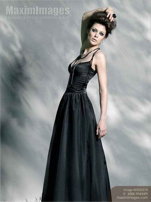 Beautiful woman in black vintage dress Stock photo of Beautiful woman in black vintage dress Buy commercial use license at MaximImages