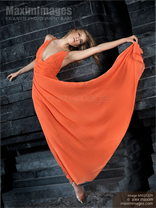 Stock photo of Beautiful Woman in Orange Dress Buy commercial use license at MaximImages