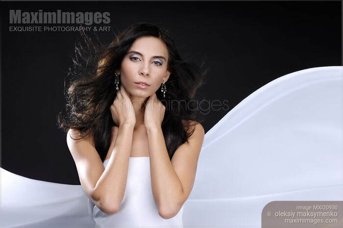 Stock photo of Beautiful Woman in White Buy commercial use license at MaximImages