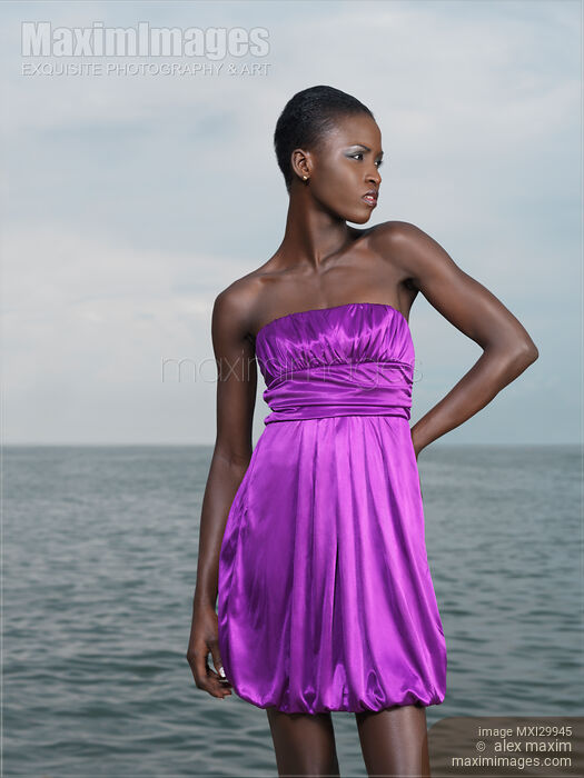 Stock photo of Beautiful Woman on a Sea Shore Buy commercial use license at MaximImages