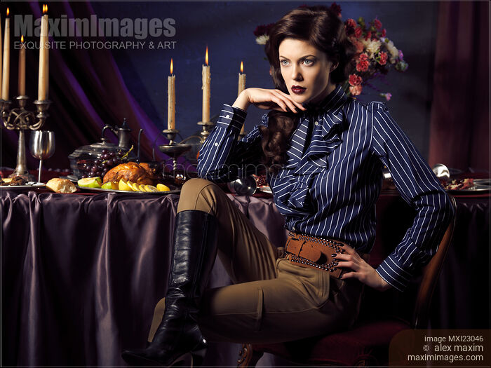 Beautiful Woman Sitting at a Festive Table Stock photo of Beautiful Woman Sitting at a Festive Table Buy commercial use license at MaximImages
