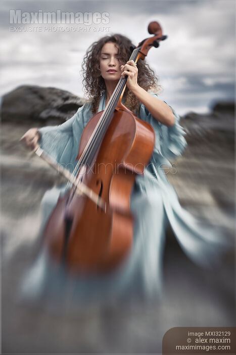 Beautiful woman thoughtfully playing cello in the nature with dreamy tranquil expression Stock photo of Beautiful woman thoughtfully playing cello in the nature with dreamy tranquil expression Buy commercial use license at MaximImages